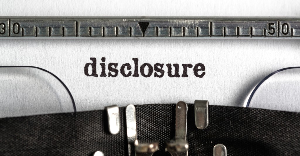 Close-up of the word “disclosure” typed on paper in a typewriter, illustrating AI meeting disclosure and consent requirements before an AI worker joins a meeting.